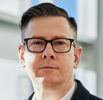 Alexander Hughes, kryptovaluuttakauppayrityksen toimitusjohtaja, headshot.